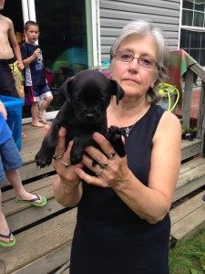 Shown here giving us a puppy.