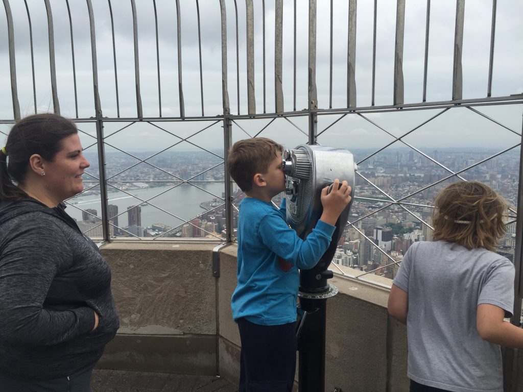 Edward looks out over Manhattan from the top of the Empire State Building